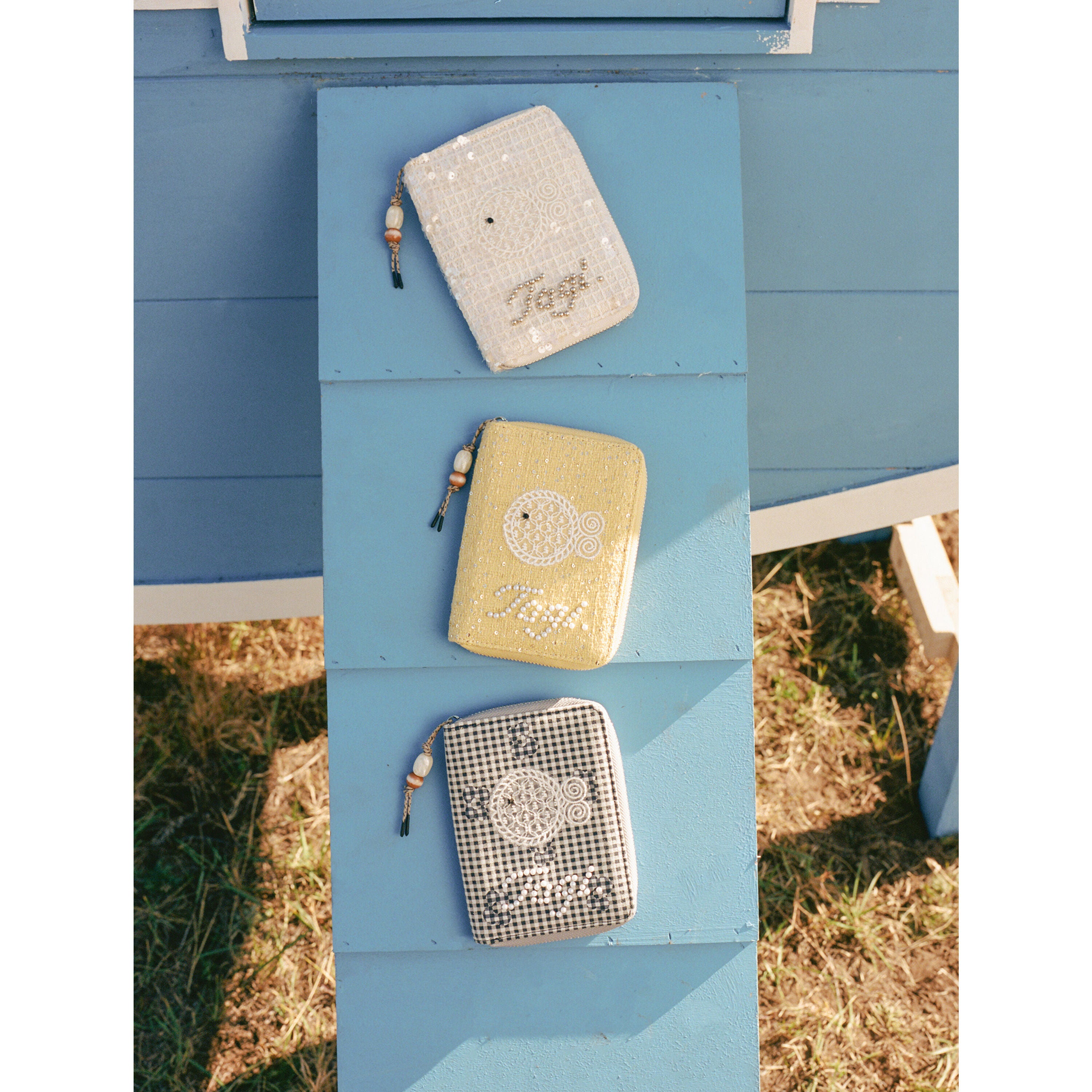 Tagi. Lace Fish Passport Holder